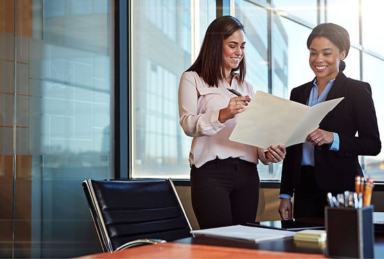 Illustration of two employees discussing over a document