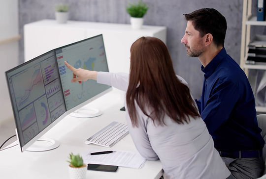 Two employees discussing their analytics.